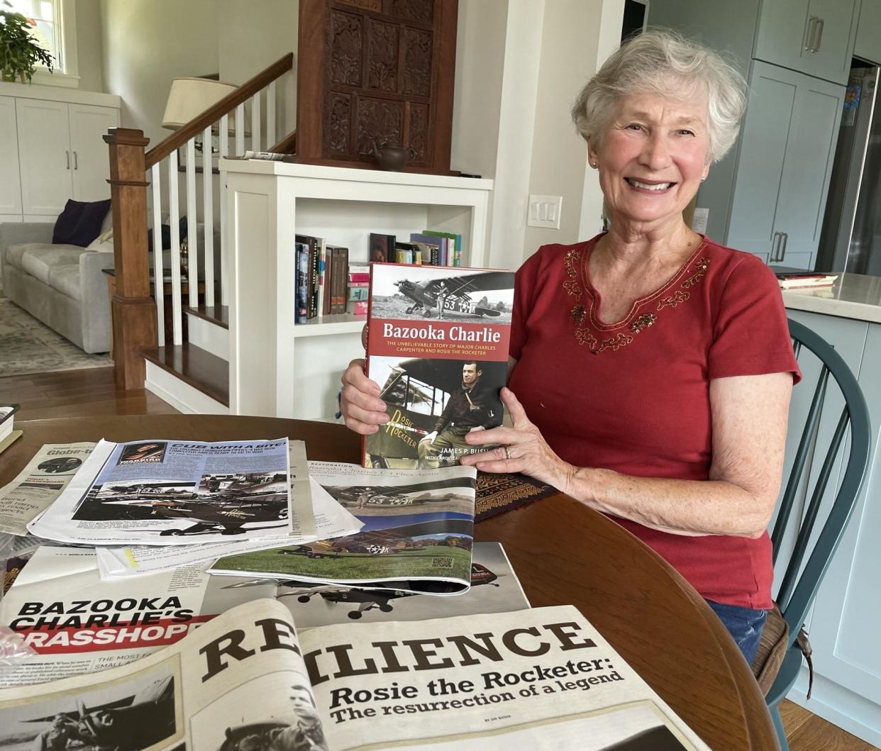 Carol Apacki holds up the book "Bazook Charlie" that tells the story of her father, Maj. Charles Carpenter, during and after World War II. Apacki insisted the book also share the emotional physical trauma her father suffered after the war as well as the strength of her mother on the homefront.