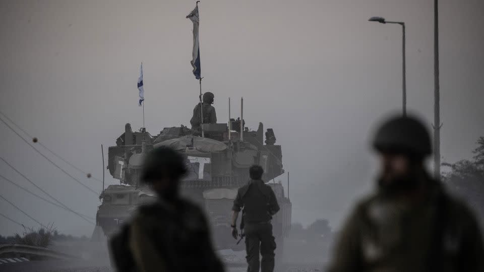Israeli tanks move near Gaza border as Israeli army deploys military vehicles around the Gaza Strip, Israel on October 12, 2023. - Mostafa Alkharouf/Anadolu/Getty Images)