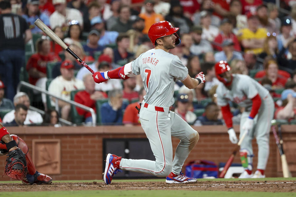 Philadelphia Phillies' Trea Turner (7) hits an RBI single during the fifth inning of a baseball game against the St. Louis Cardinals, Monday, April 8, 2024, in St. Louis. (AP Photo/Scott Kane)
