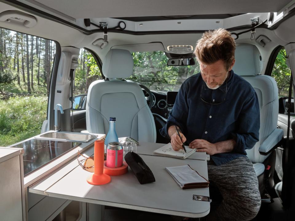 A person inside Tonke's EQV camper van.