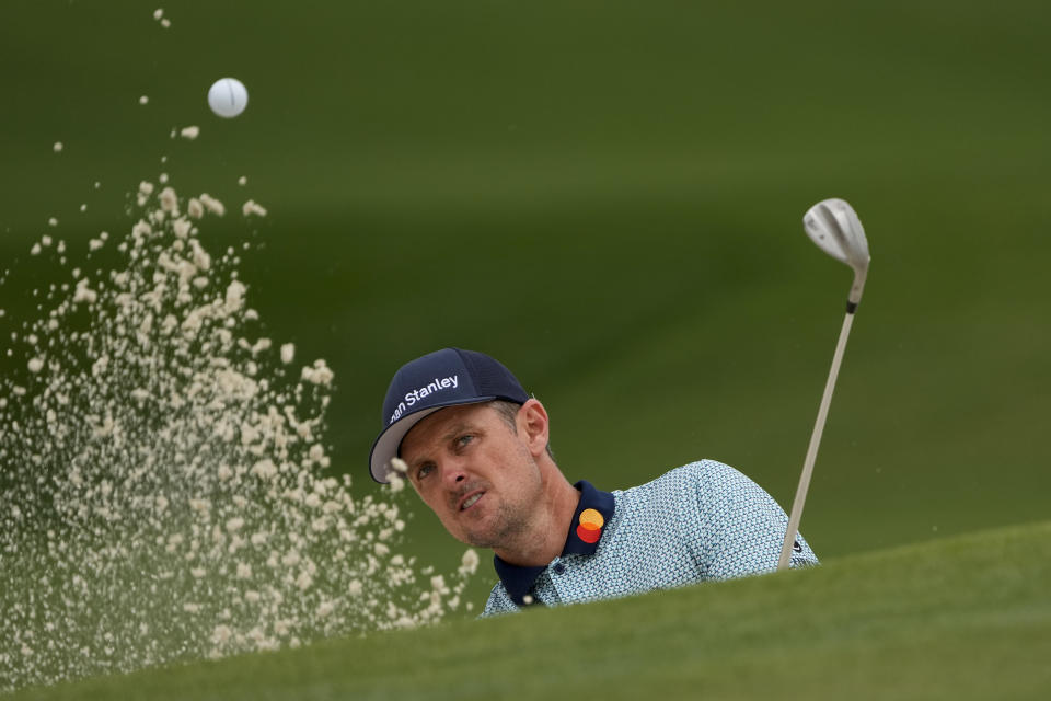 Justin Rose, of England, hits out of a bunker on the seventh hole during the second round of the Masters golf tournament on Friday, April 9, 2021, in Augusta, Ga. (AP Photo/Gregory Bull)