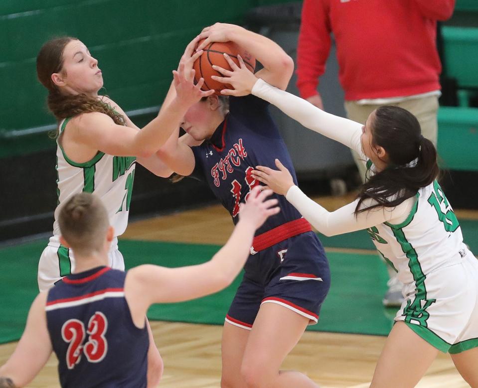 West Branch's Sophie Gregory, left, and Presely Egli, right, force a turnover against Fitch's Kylie Folkwein, Saturday, Feb. 3, 2024.