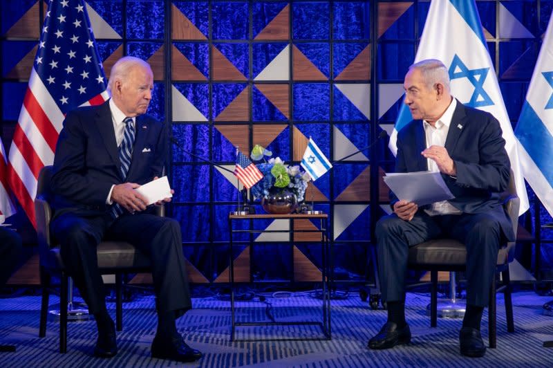 U.S. President Joe Biden (L) meets with Israeli Prime Minister Benjamin Netanyahu to discuss the war with Hamas, in Tel Aviv, Israel, on October 18. Biden's support for Israel may cost him votes in 2024, some experts say. File Photo by Miriam Alster/UPI