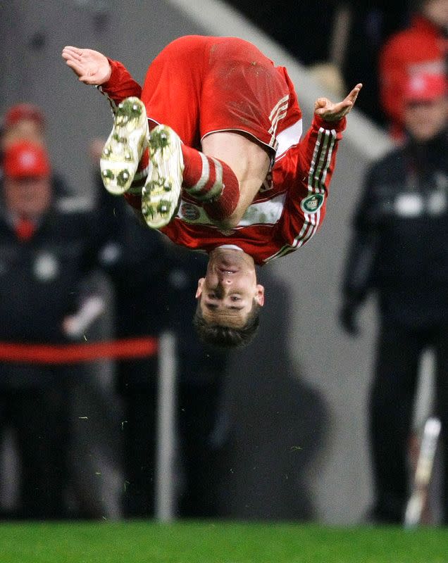 FILE PHOTO: Miroslav Klose of Bayern Munich celebrates his goal with a somersault during the German soccer cup semi-final match against Wolfsburg in Munich