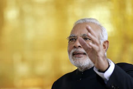 Prime Minister Narendra Modi reacts during a meeting with Brazil's President Dilma Rousseff (not pictured) on the sidelines of the 6th BRICS summit at the Alvorada Palace in Brasilia July 16, 2014. REUTERS/Ueslei Marcelino