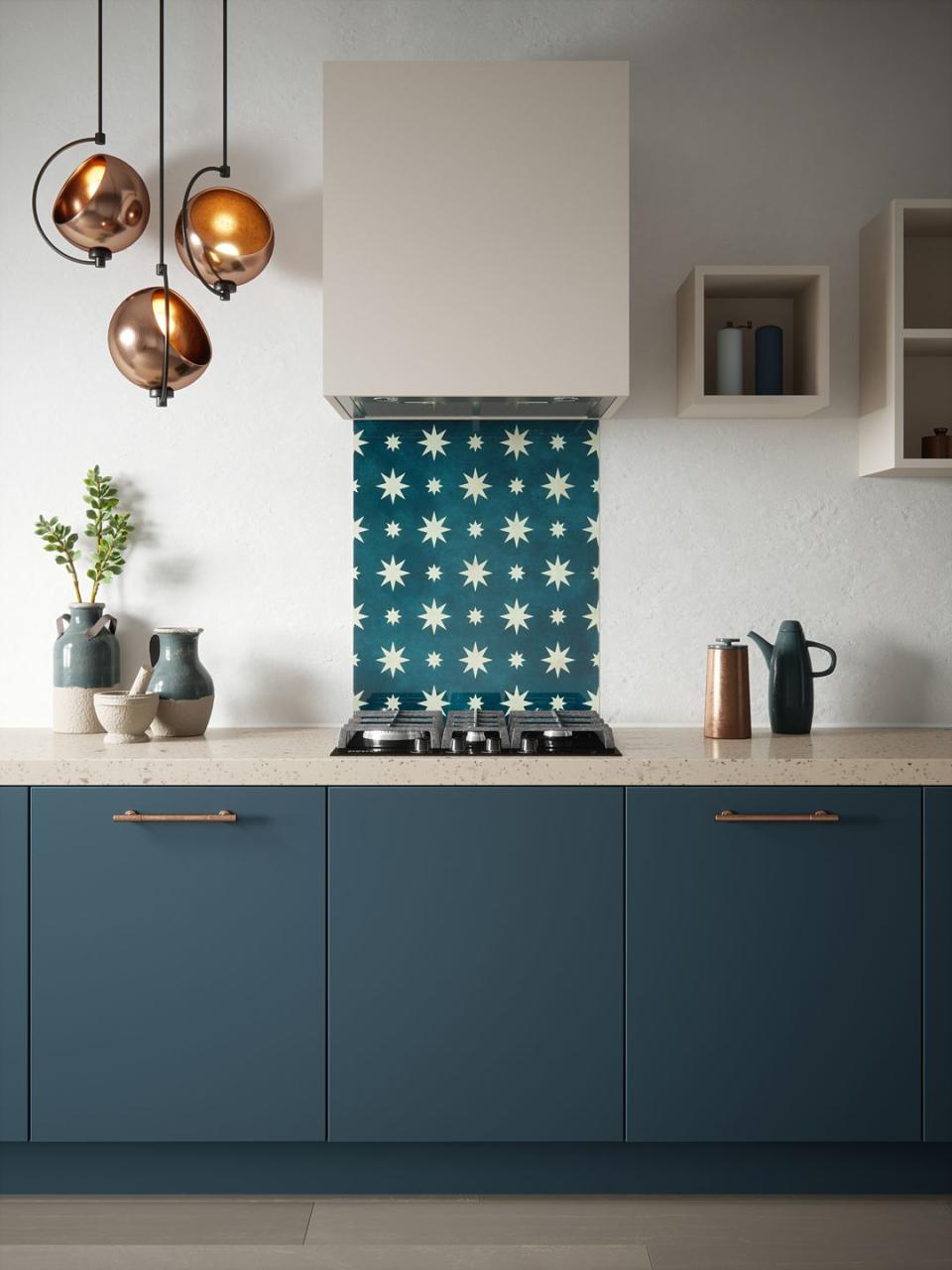 <p>With a nod to the celestial trend, the contemporary Jasper splashback features a striking star design on a gently textured midnight blue background.</p><p>House Beautiful Jasper splashback in Indigo (600mm x 750mm), £175</p><p><a class="link " href="https://www.splashback.co.uk/shop/designer-splashbacks/house-beautiful/house-beautiful-jasper-splashback-600x750mm/" rel="nofollow noopener" target="_blank" data-ylk="slk:BUY NOW;elm:context_link;itc:0;sec:content-canvas">BUY NOW</a><br></p>