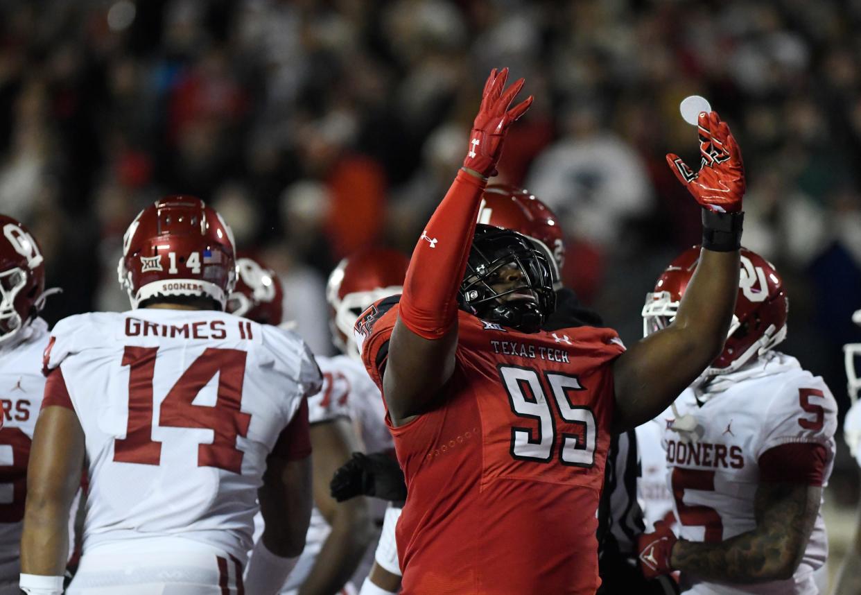 Texas Tech's defensive lineman Jaylon Hutchings (95) celebrates his touchdown against Oklahoma in their last Big 12 home football game, Saturday, Nov. 26, 2022, Jones AT&T Stadium. 