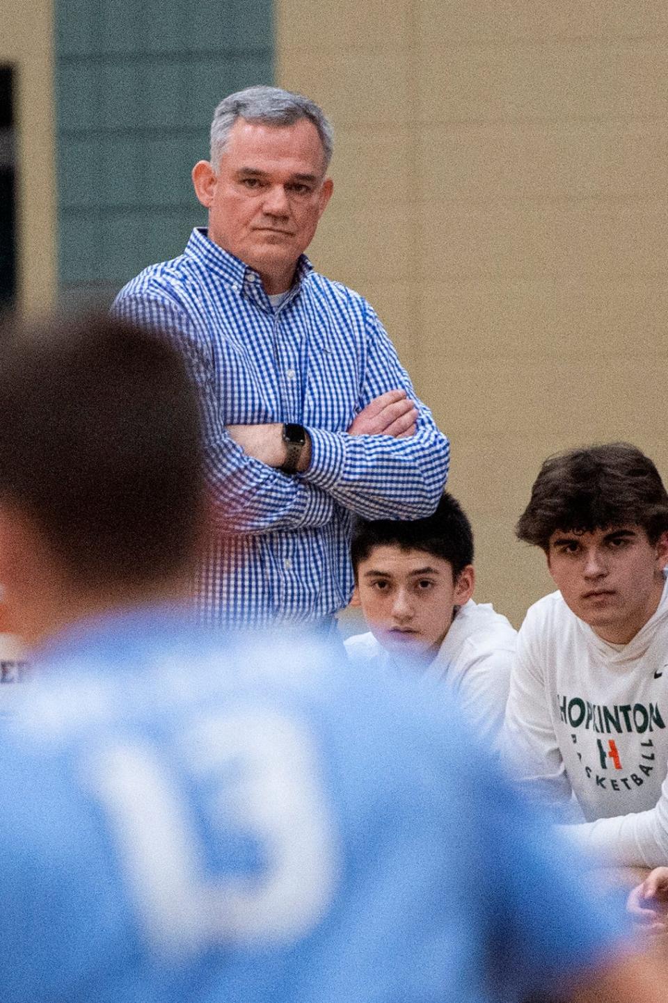 Hopkinton High head coach Tom Keane keeps his eyes on the action on the court during the game against Medfield in Hopkinton, Feb. 6, 2024. The Hillers beat the Big Blue, 79-57.