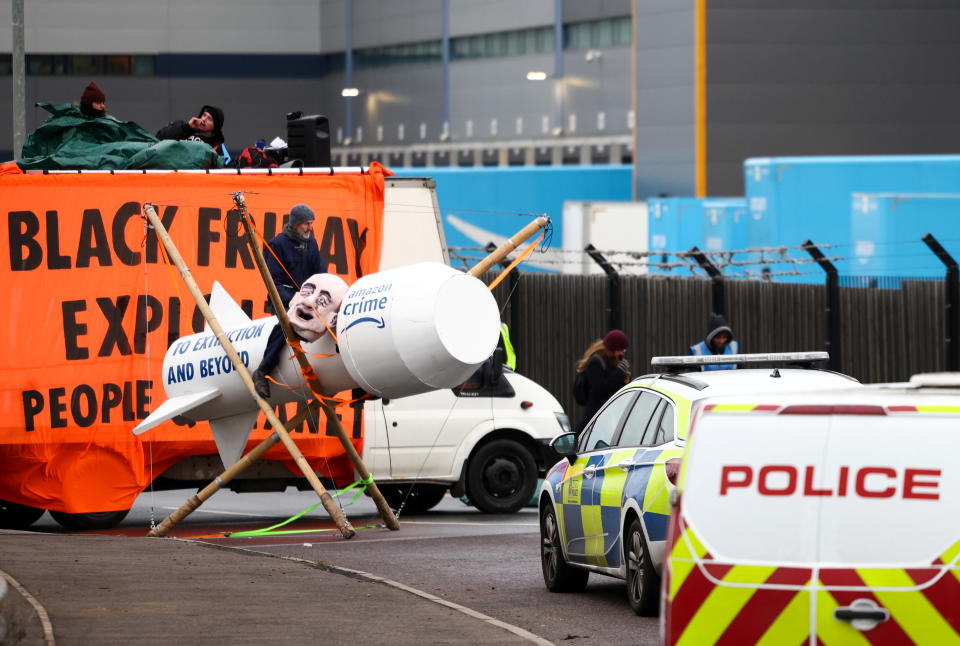 Extinction Rebellion activists block an entrance to an Amazon fulfilment centre in Tilbury, Essex, Britain, November 26, 2021. REUTERS/Henry Nicholls