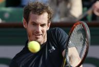 Great Britain's Andy Murray returns the ball to Argentina's Facundo Arguello during the men's first round at the Roland Garros 2015 French Tennis Open in Paris on May 25, 2015