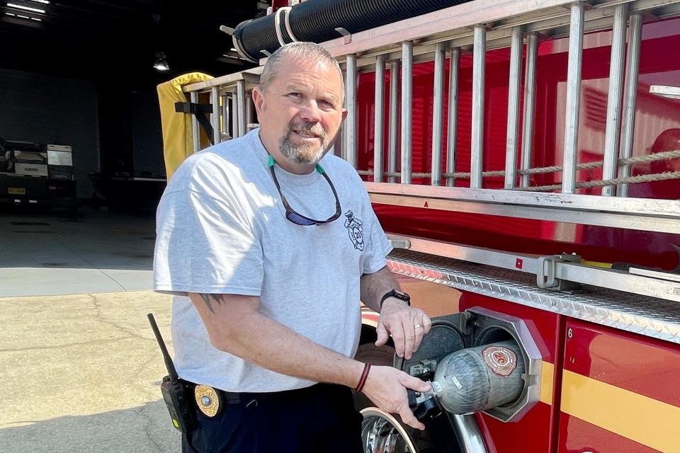 Baker Fire District Chief Brian Easterling shows off one of the department's fire trucks on March 25, 2022. Easterling was charged with first-degree premeditated murder in the death of a 63-year-old Pensacola shop owner on Sunday.