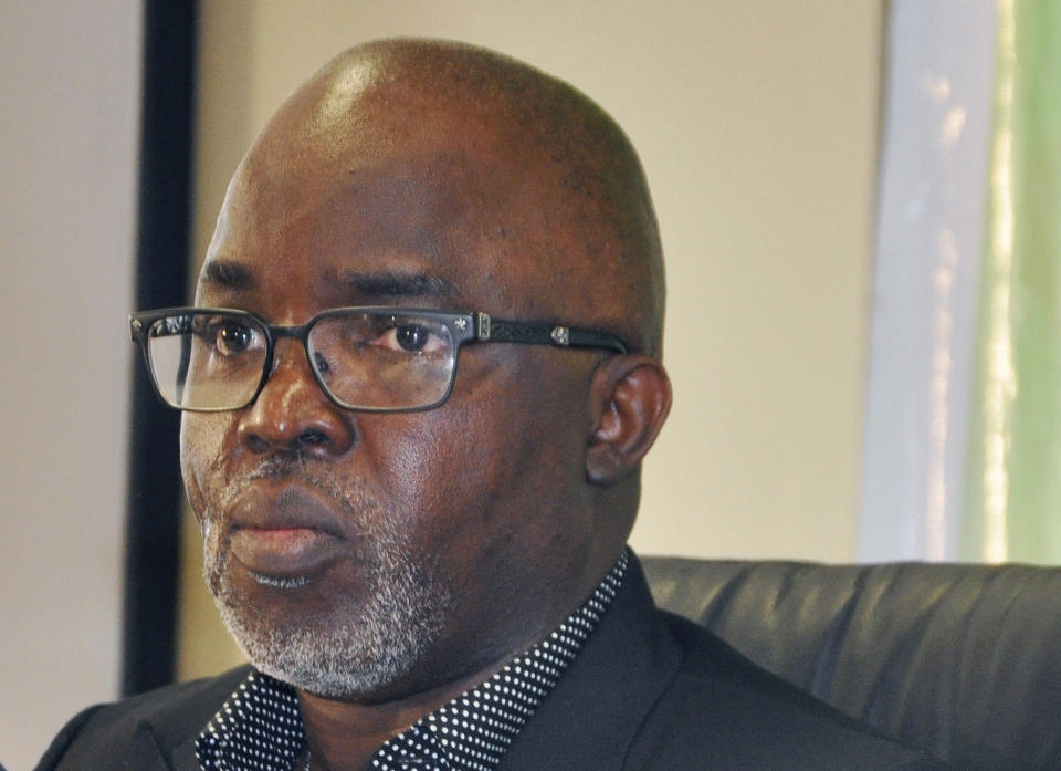 FILE - In this Wednesday, July 15, 2015 file photo, Nigeria Football Federation President Amaju Pinnick, speaks to the media at the National Stadium in Abuja, Nigeria, Wednesday, July 15, 2015. FIFA has given Nigeria and Ghana final deadlines to avoid international suspensions because of outside interference in their football associations. FIFA says the Nigerian Football Federation headquarters must be handed back to the elected leadership by Monday, Aug. 20, 2018 or the country will be suspended from international competition. (AP Photo/Olamikan Gbemiga, File)