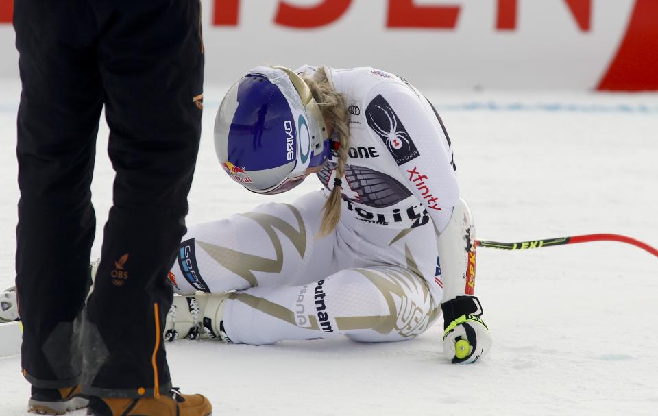 United States’ Lindsey Vonn lies on the snow in pain. (AP Photo/Giovanni Auletta)