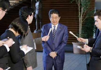 Japanese Prime Minister Shinzo Abe tells reporters at his office in Tokyo on March 12, 2018, that he deeply apologizes to the public over the Finance Ministry's alternations of documents over a state land sale. Mandatory credit Kyodo/via REUTERS