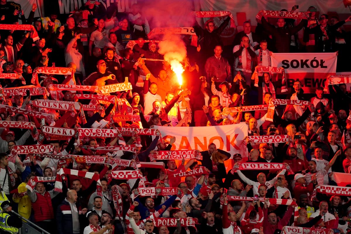 Poland fans set off flares during Sunday’s Nations League game against Wales in Cardiff (Mike Egerton/PA) (PA Wire)