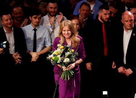 Slovakia's presidential candidate Zuzana Caputova receives flowers at her party's headquarters in Bratislava, Slovakia, March 30, 2019. REUTERS/David W Cerny