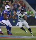 TORONTO, ON - DECEMBER 16: Marshawn Lynch #24 of the Seattle Seahawks runs against the Buffalo Bills at Rogers Centre on December 16, 2012 in Toronto, Ontario. (Photo by Rick Stewart/Getty Images)