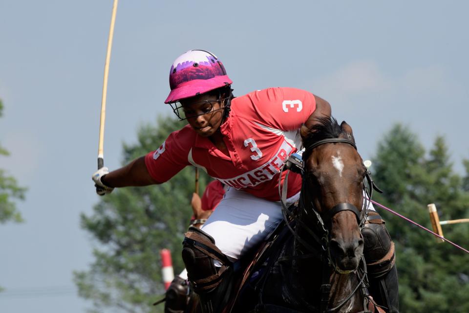 Shariah Harris gets ready to take a shot during a recent polo practice.