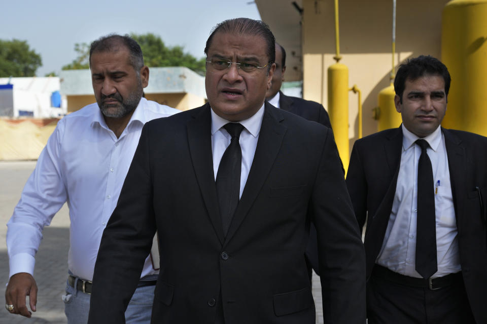 Salman Sardar, center, with other lawyers of Pakistan's former Prime Minister Imran Khan's legal team, arrive for a hearing of a case against Khan at the District Jail, in Attock, Pakistan, Wednesday, Aug. 30, 2023. A court asked the official in charge of the Attock prison to keep former Prime Minister Khan there until at least Wednesday, when Khan is expected to face a hearing on charges of "exposing an official secret document" in an incident last year when he waved a confidential diplomatic letter at a rally. The Islamabad High Court on Tuesday suspended the corruption conviction and three-year prison term of him, his lawyers and court officials said. (AP Photo/Anjum Naveed)