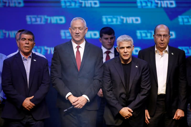 FILE PHOTO: Blue and White party leader Benny Gantz and party co-leaders Yair Lapid, Moshe Yaalon and Gaby Ashkenazi react at the party's headquarters following the announcement of exit polls during Israel's parliamentary election in Tel Aviv