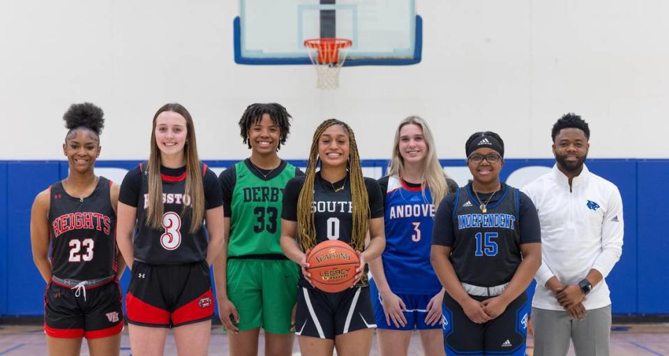 The 2024 Wichita Eagle All-Metro team for girls basketball. From left to right: Heights’ SaMiyah Ellis, Hesston’s Kendal Brueggen, Derby’s Macayla Askew, Maize South’s Ashley Singhateh, Andover’s Brooke Walker, Independent’s Zoey Buckner-Franklin and Independent coach EJ Garnes.