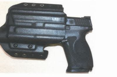 This is the handgun Sgt. Christopher used to shoot Romen Phelps on May 13, 2022, on the stage at Dreyfoos School of the Arts and the holster that carried it. Unlike holsters worn by on-duty officers, this holster allows the officer to draw the gun with only a firm tug upward. Investigators noted that this holster made it easier for Phelps and Nagel to struggle for control of the gun.