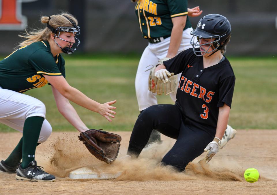 Corina Miller of Sauk Rapids concentrates on the ball as Tech's Olivia Laudenbach slides into second Wednesday, May 19, 2021, in St. Cloud. 