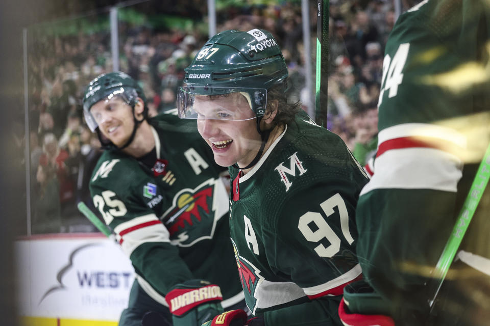 Minnesota Wild left wing Kirill Kaprizov (97) smiles after scoring a hat trick, during the third period of an NHL hockey game against the San Jose Sharks, Sunday, March 3, 2024, in St. Paul, Minn. (AP Photo/Stacy Bengs)