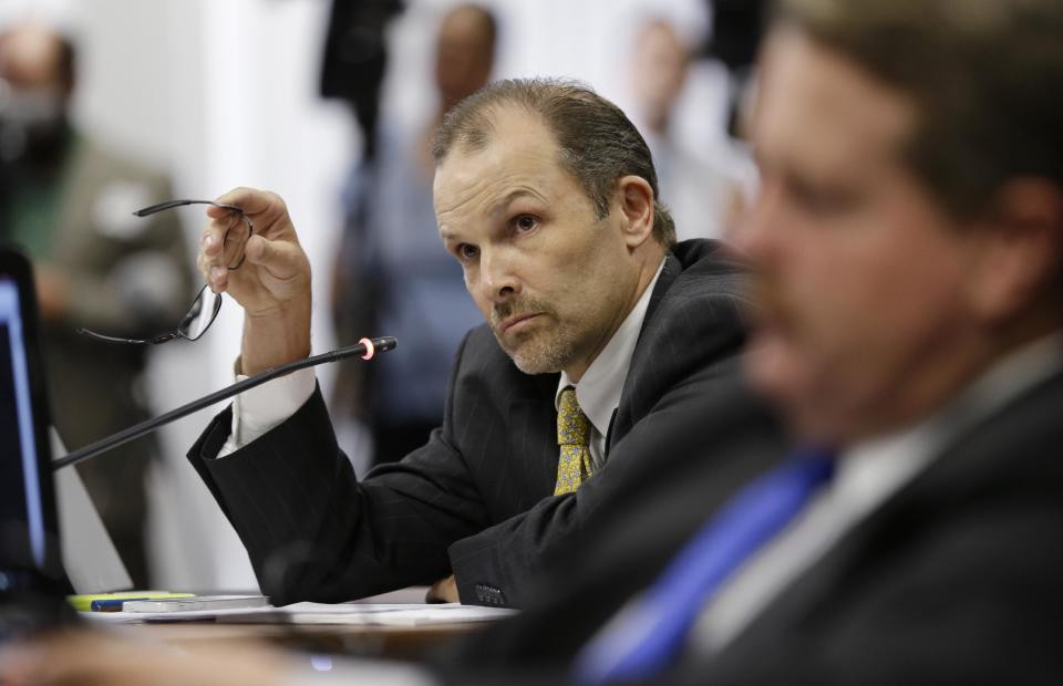 FILE - In this Sept. 17, 2013 file photo, State Board of Education member Thomas Ratliff listens to testimony during a public hearing on proposed new science textbooks., in Austin, Texas. The Texas Board of Education is poised to tighten rules on who can serve on citizen review panels that scrutinize proposed textbooks for use statewide, hoping to tamp down future controversies over the teaching of evolution and other issues. (AP Photo/Eric Gay, File)