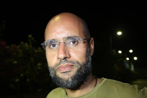 Ousted Libyan leader Moamer Kadhafi's fugitive son Seif al-Islam, seen here in August 2011, has been arrested in the south of the country, a senior National Transitional Council official said