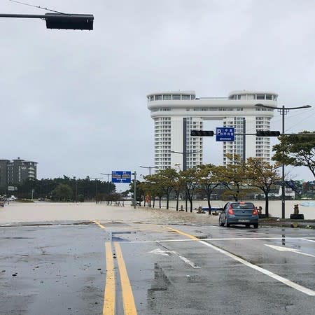 A road is partially submerged in water after Typhoon Mitag brought heavy rain and flood to Gangneung