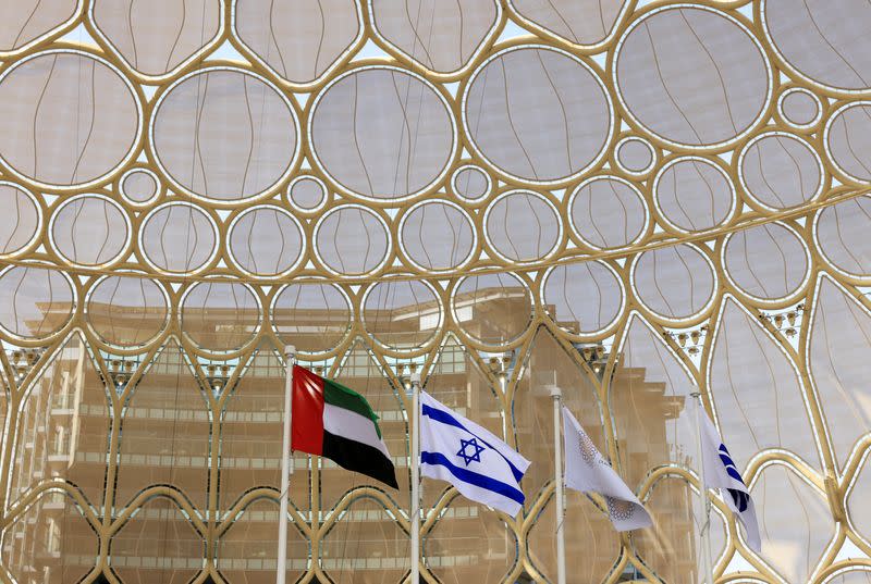 FILE PHOTO: Flags of United Arab Emirates, Israel and Expo 2020 Dubai flutter during Israel's National Day ceremony at Expo 2020 Dubai, in Dubai