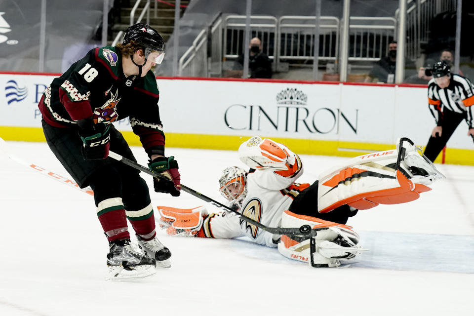 Arizona Coyotes center Christian Dvorak (18) scores a goal against Anaheim Ducks goaltender John Gibson (36) on a penalty shot in the second period during an NHL hockey game, Monday, Feb. 22, 2021, in Glendale, Ariz. (AP Photo/Rick Scuteri)