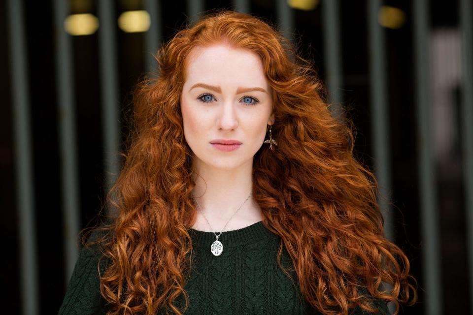 A redheaded model with long hair from Northern Ireland