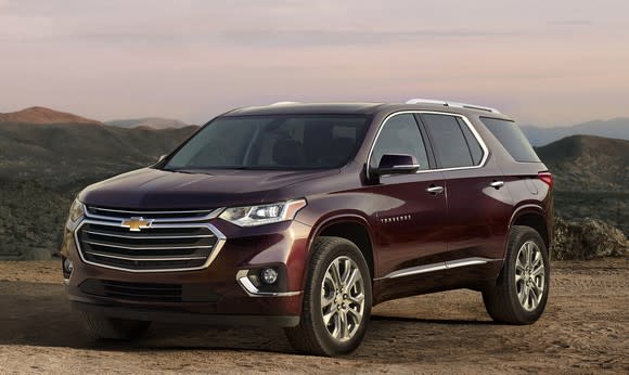 A dark red 2018 Chevrolet Traverse, a large seven-passenger crossover SUV.