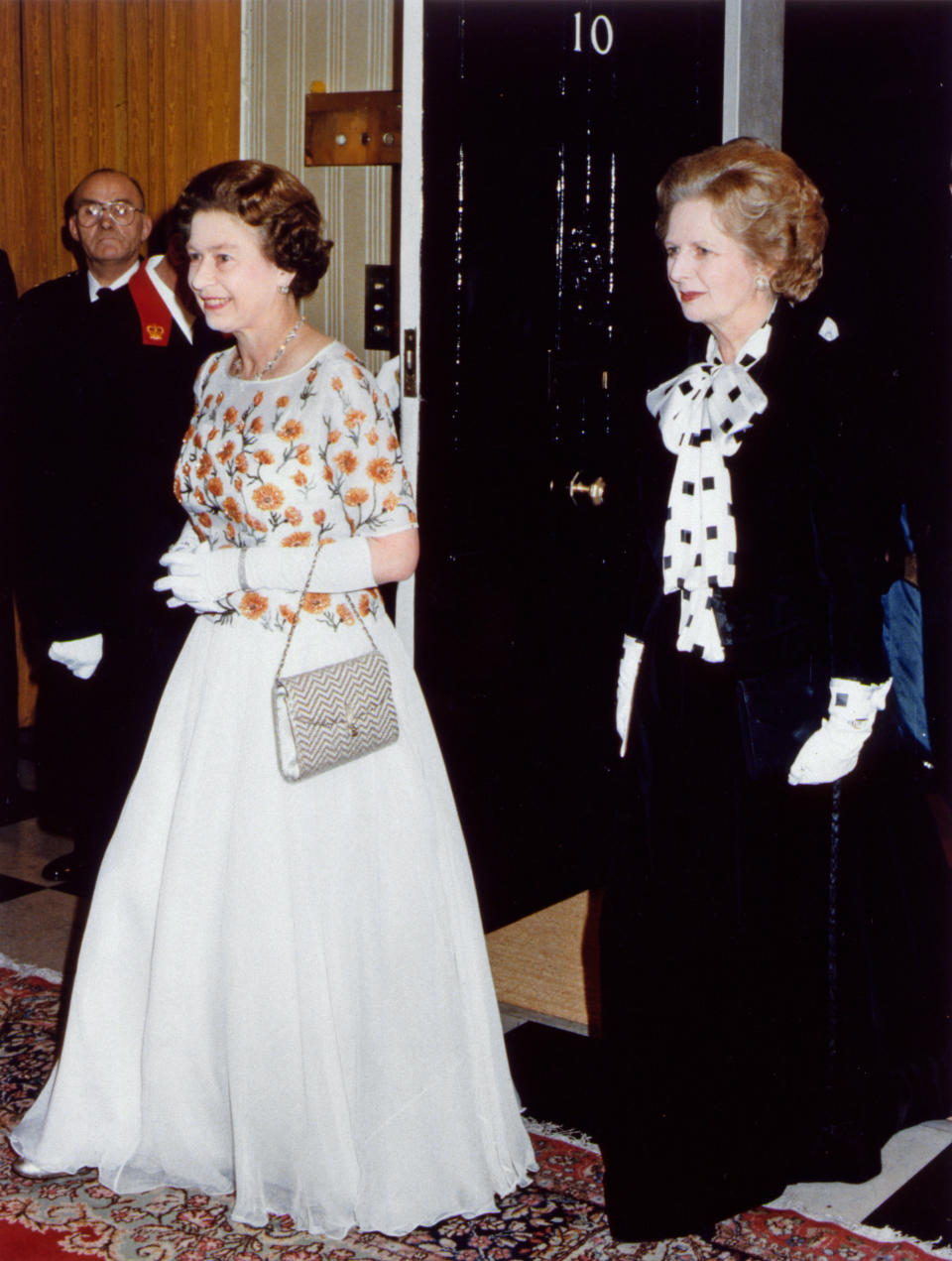 Her Majesty Queen Elizabeth II and Prime Minister Margaret Thatcher at Number 10 Downing Street wearing ball gowns December 1985. (Photo by Daily Mirror /Mirrorpix/Getty Images)