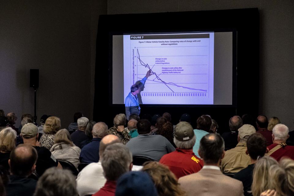 Economist and author John Lott Jr. addresses attendees of "The War on Guns" seminar at the NRA annual meeting on May 6. (Photo: Joseph Rushmore for HuffPost)