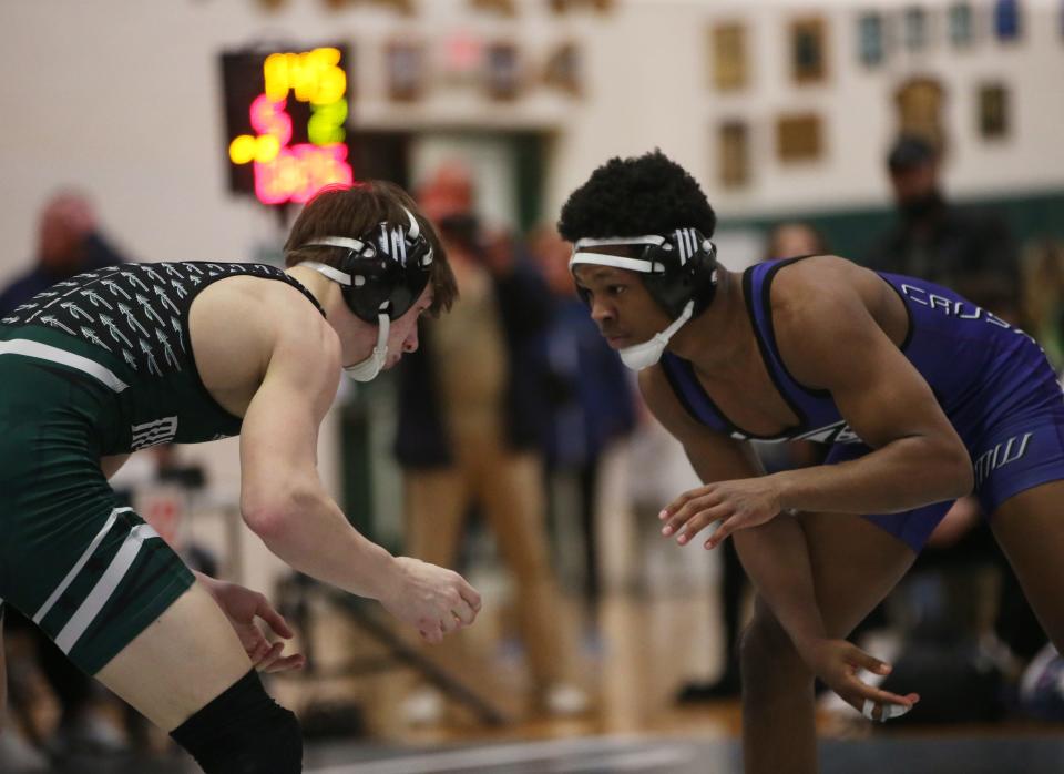 From left, Monroe-Woodbury's Jordan Brown and  Minisink Valley's Luke Greiner wrestle in the 145 lb match during the Section 9 Duals semifinal at Minisink Valley High School on January 11, 2023.