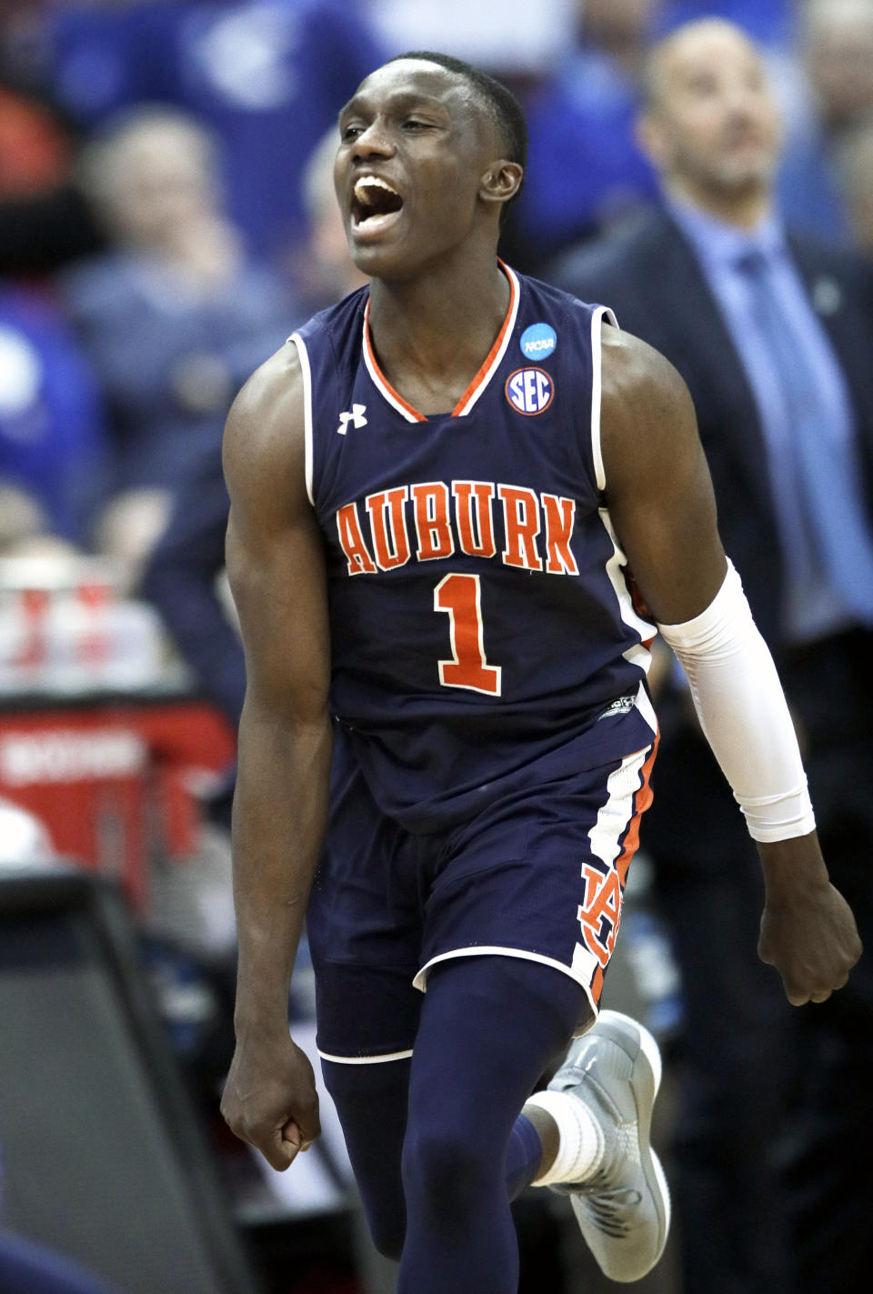 Auburn's Jared Harper celebrates after Auburn defeated Kentucky in the Midwest Regional final game in the NCAA men's college basketball tournament Sunday, March 31, 2019, in Kansas City, Mo. Auburn won 77-71 in overtime. (AP Photo/Orlin Wagner)