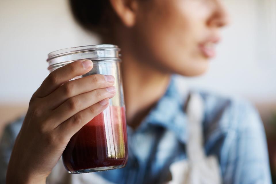 Woman holding freshly juiced juice