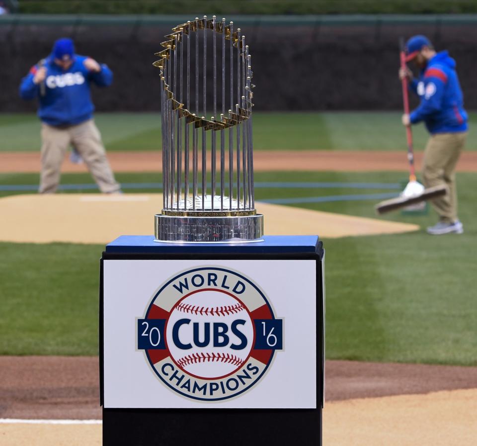 The flags atop the Cubs' World Series trophy were reportedly broken off during Theo Epstein's charity concert. (AP Photo/Matt Marton)