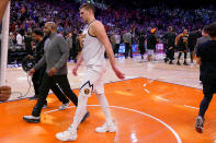 Denver Nuggets center Nikola Jokic leaves the court after Game 4 of an NBA basketball Western Conference semifinal game against the Phoenix Suns, Sunday, May 7, 2023, in Phoenix. The Suns defeated the Nuggets 129-124. (AP Photo/Matt York)