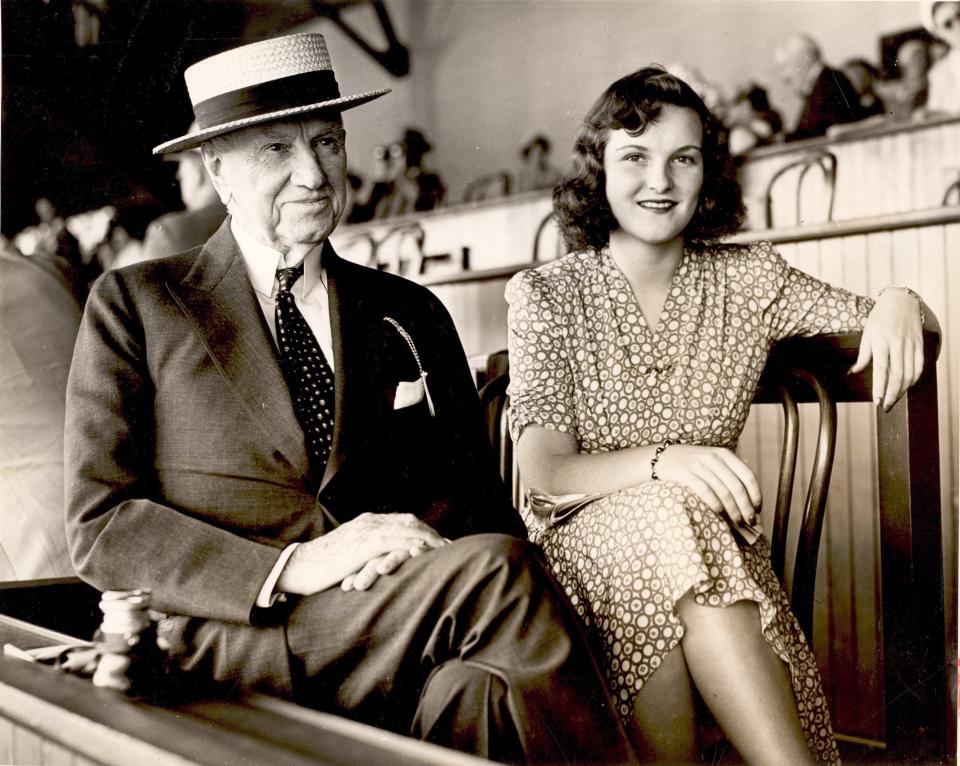 E.R. Bradley sits with Beatrice MacGuire at Saratoga Springs in August 1941. Bradley owned four horses that won the Kentucky Derby.