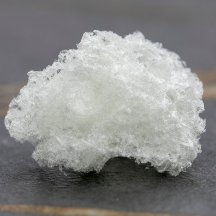 a white rock on a beach