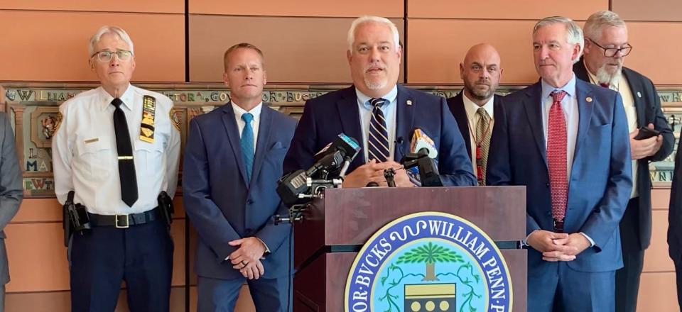 Bucks County District Attorney Matt Weintraub (center) with other  area law enforcement officials including Montgomery County DA Kevin Steele (right, front) announce the dismantling of a million-dollar catalytic converter theft ring on June 28, 2023.