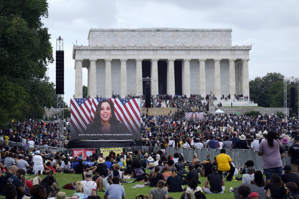 A screen displays a video with Democratic vice presidential candidate Kamala Harris speaking during the March on Washington, Friday Aug. 28, 2020, at the Lincoln Memorial in Washington, on the 57th anniversary of the Rev. Martin Luther King Jr.'s "I Have A Dream" speech. (AP Photo/Carolyn Kaster)