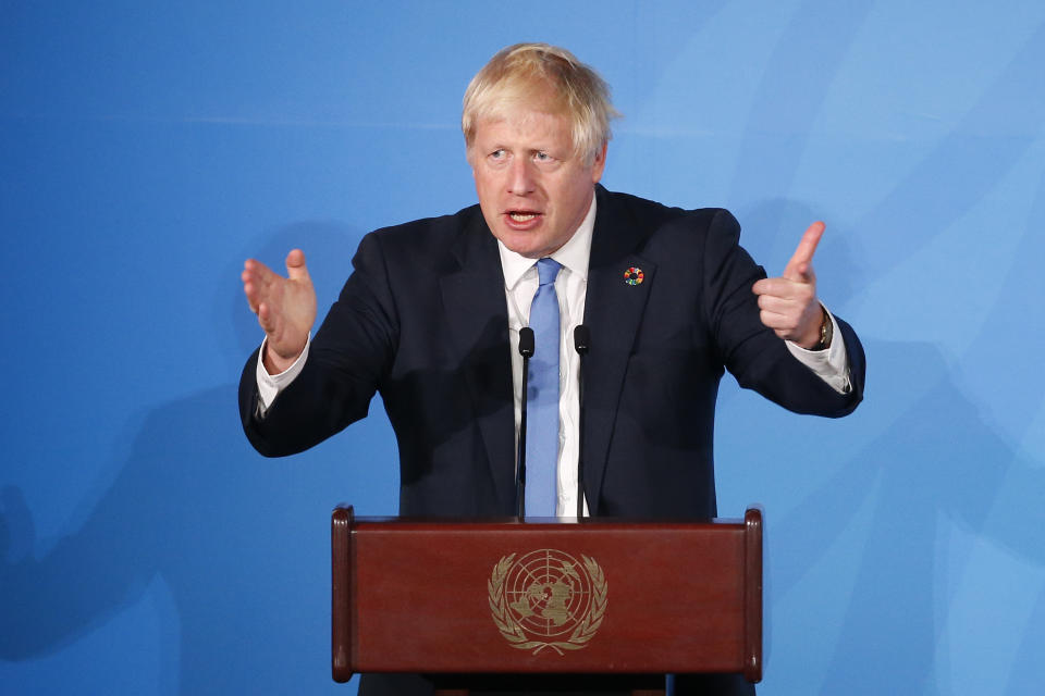Britain's Prime Minister Boris Johnson addresses the Climate Action Summit in the United Nations General Assembly at the U.N. headquarters, Monday, Sept. 23, 2019. (AP Photo/Jason DeCrow)