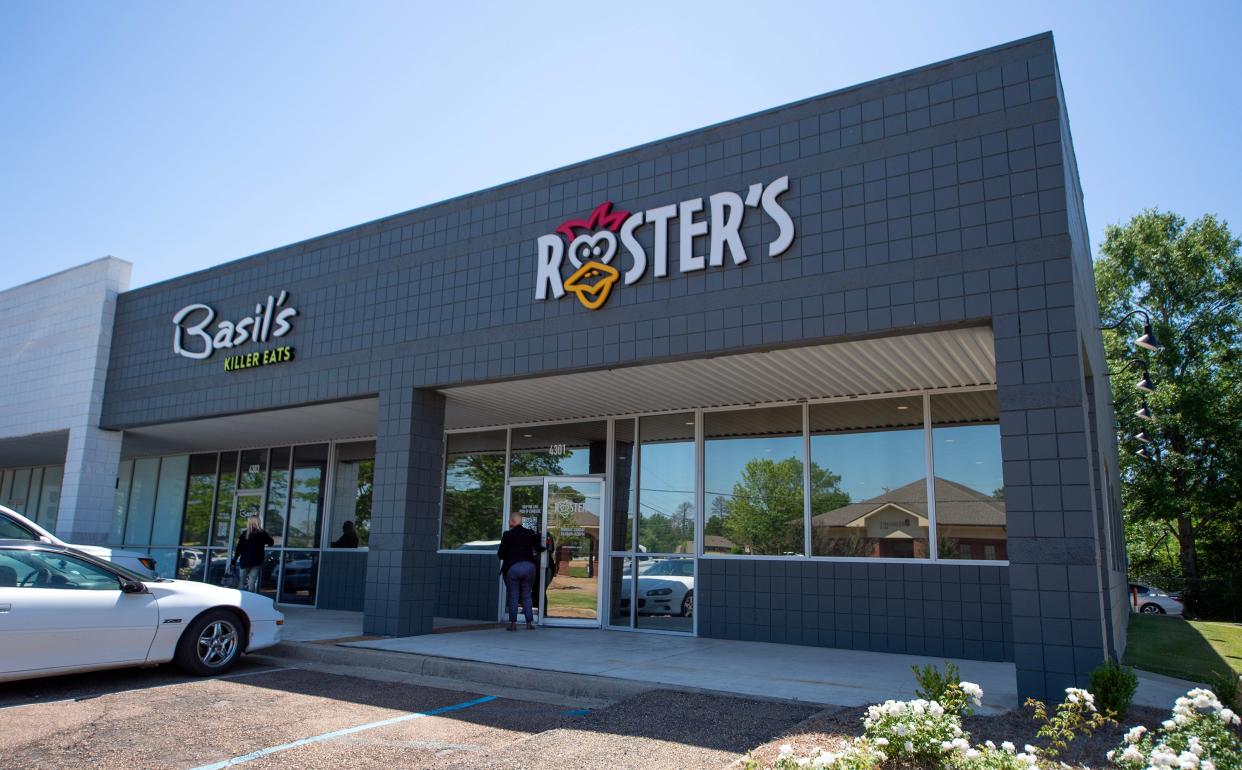 Customers enter both the Basil's and Rooster's doors that lead to one large space on Tuesday, April 23. The Basil’s/Rooster’s combo restaurant hosted a brisk crowd during lunch hour at the Flowood eateries.