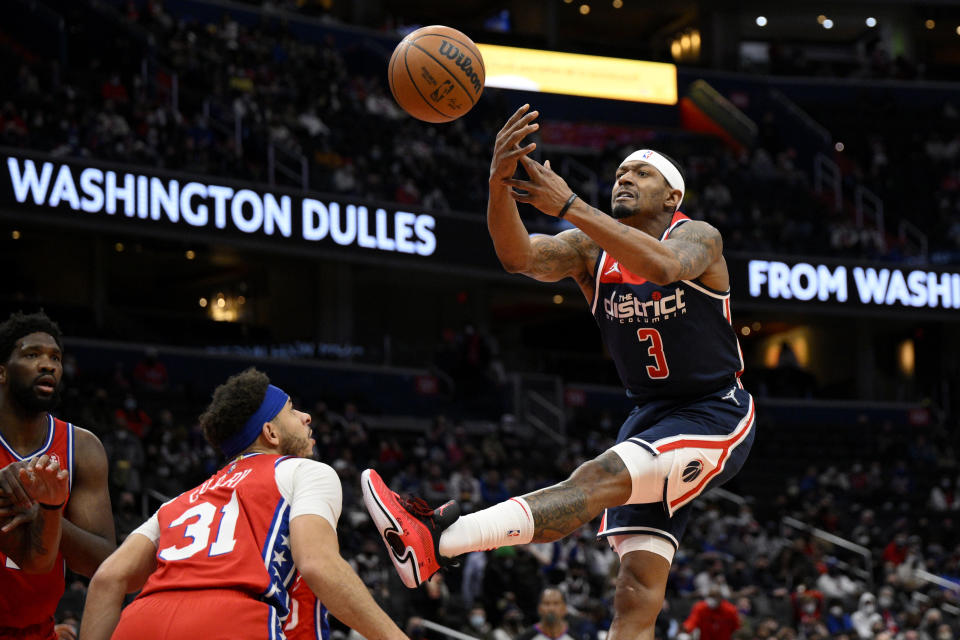 Washington Wizards guard Bradley Beal (3) loses the ball next to Philadelphia 76ers guard Seth Curry (31) during the first half of an NBA basketball game, Monday, Jan. 17, 2022, in Washington. (AP Photo/Nick Wass)