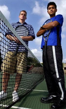 Vivek Ramaswamy (right) pictured in 2003 in The Enquirer with Ryan Fischer, of Holmes High School, when the two won $20,000 scholarships from Coca-Cola.